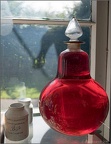 Red in Bottle with Ghost in the Window